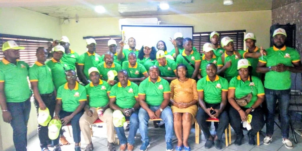 The C-Success team, in branded shirts and caps, at a gathering in Aba.